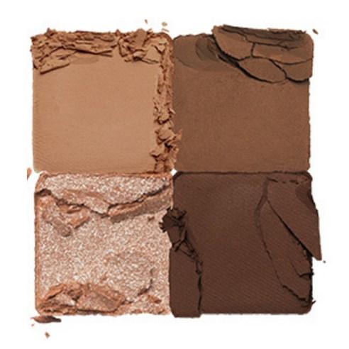 Four square eyeshadow pans in various matte and shimmer brown shades with a cracked texture