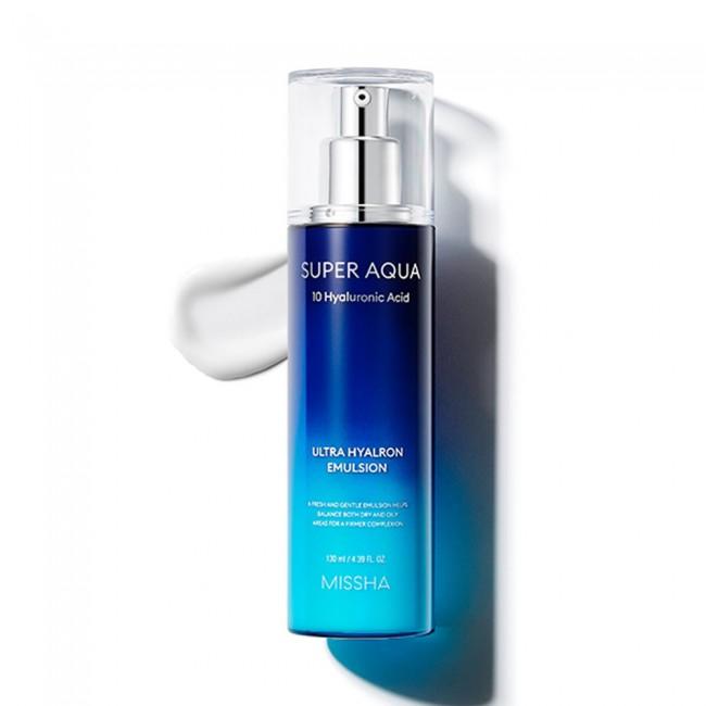 Blue gradient pump bottle of hydrating emulsion with hyaluronic acid on white background and smooth product texture nearby
