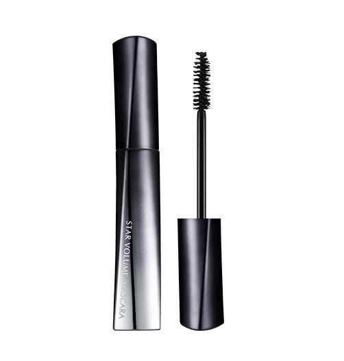 Sleek black and silver mascara tube with a volumizing brush applicator beside it on a white background