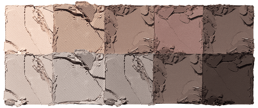 Ten broken neutral-toned eyeshadow pans arranged in two rows, showcasing versatile matte shades.