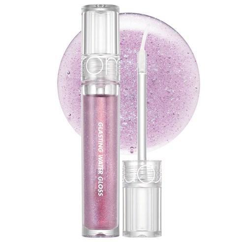 Clear tube with light purple shimmering gloss and applicator wand on white background with gloss swatch behind
