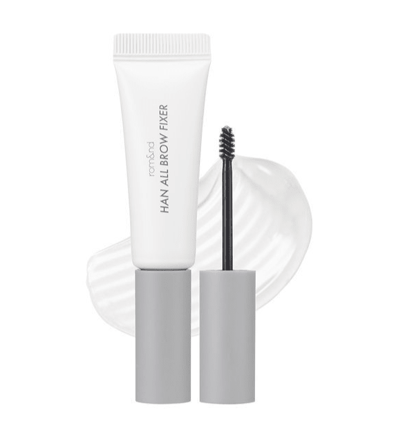 White and gray eyebrow gel tube with spoolie brush and clear styling gel smear on white background