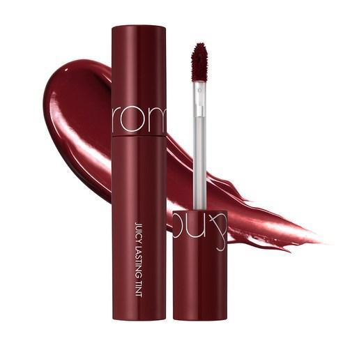 Deep red lip tint tube with applicator wand alongside glossy swatch showing juicy shine finish