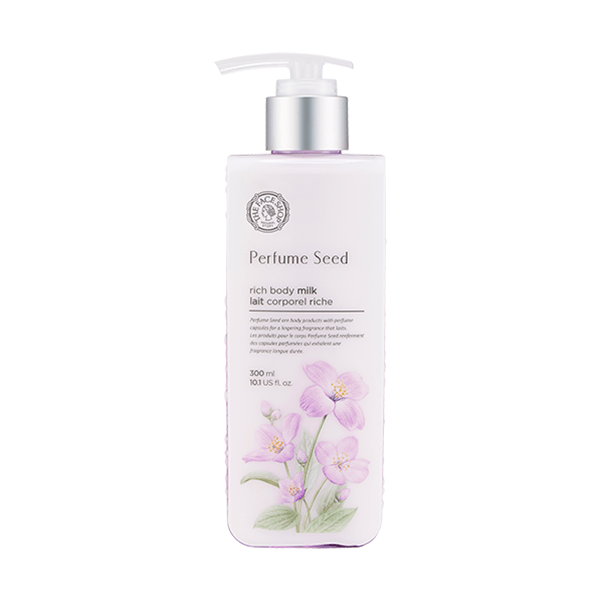 Tall bottle of scented body milk with pump and delicate purple floral design on front label