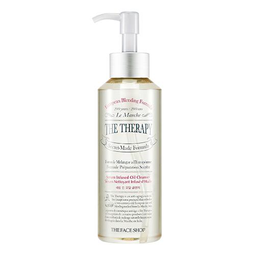 Clear pump bottle of serum infused oil cleanser with moisturizing formula and elegant white and gold label design