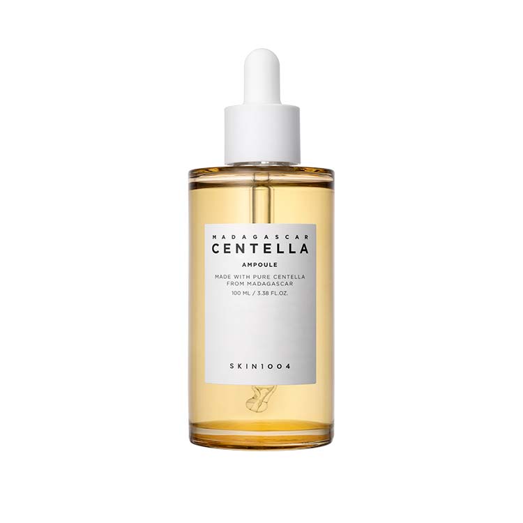 Clear amber ampoule bottle with white dropper and minimalist label for skin damage repair serum on white background