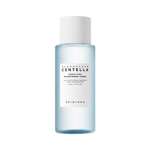 Light blue translucent bottle of brightening toner with white cap and minimalist black text label on white background