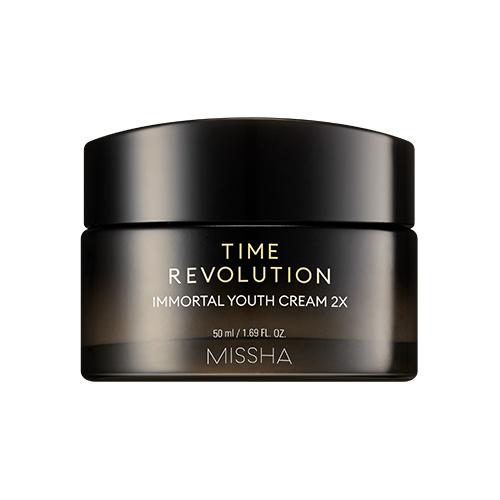 Dark amber cosmetic jar with gold lettering containing anti-aging youth cream on white background