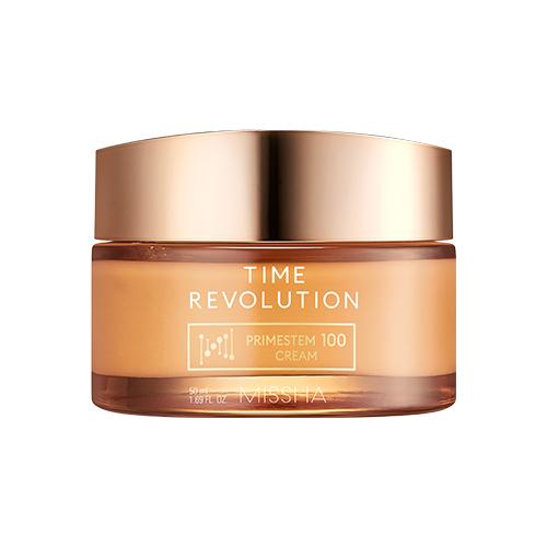 Glass jar of MISSHA anti-aging cream with a shiny gold lid on a white backdrop