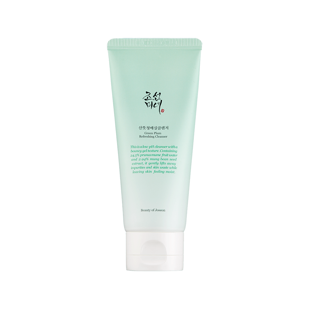 Light green tube of gentle exfoliating cleanser with white cap and black text on front against white background