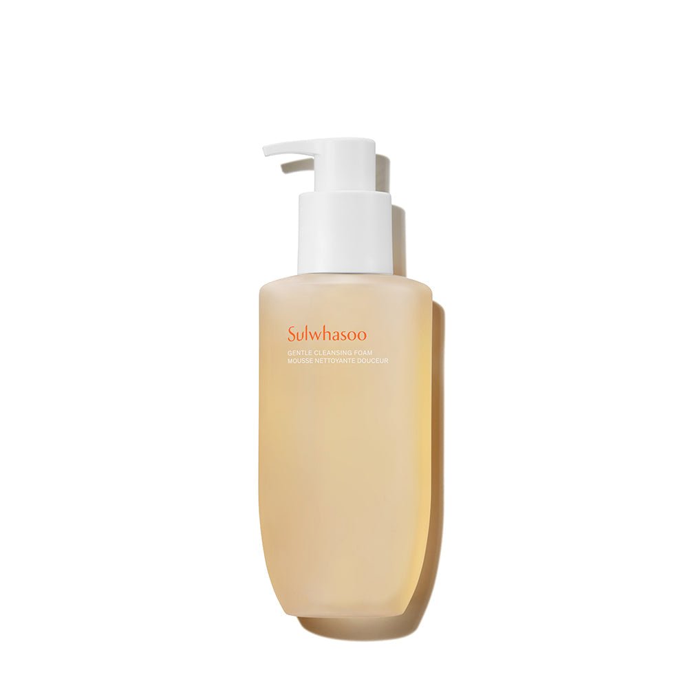Creamy beige pump bottle of gentle cleansing foam with minimalist design on white background