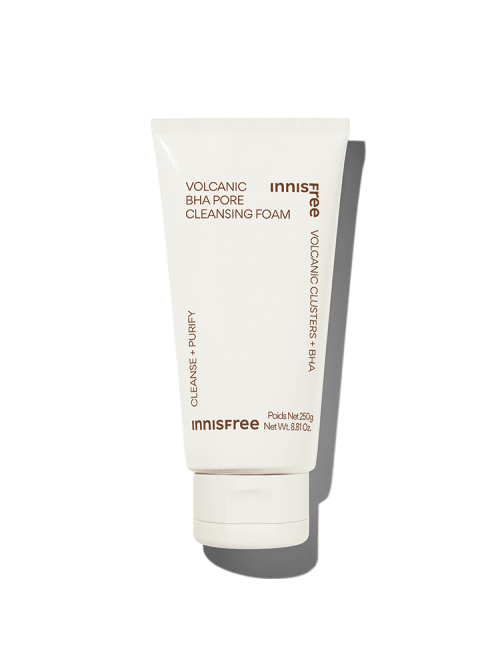 Tube of volcanic BHA cleansing foam in soft cream packaging with brown text emphasizing deep pore cleansing benefits