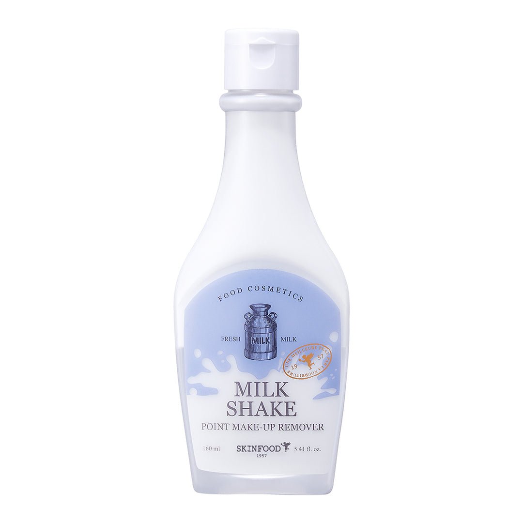 White bottle of gentle milk-based makeup remover with blue label and simple flip cap on white background