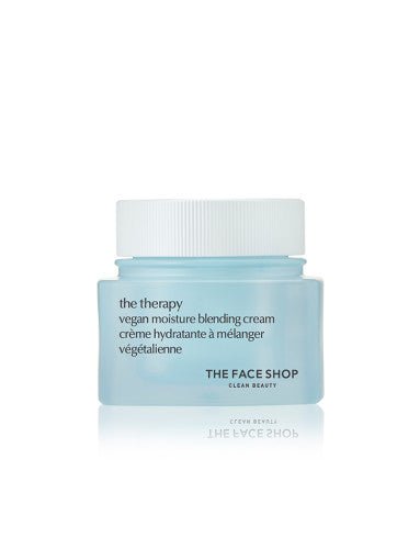 Light blue jar of vegan moisture blending cream with white lid and simple black text on a white background