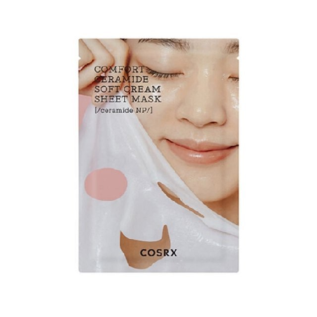 Person gently peeling off a translucent cream sheet mask with soft hydrated skin and closed eyes