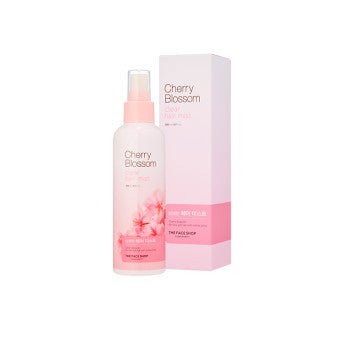Pink spray bottle of cherry blossom hair mist with matching pink and white rectangular box for frizz control benefits