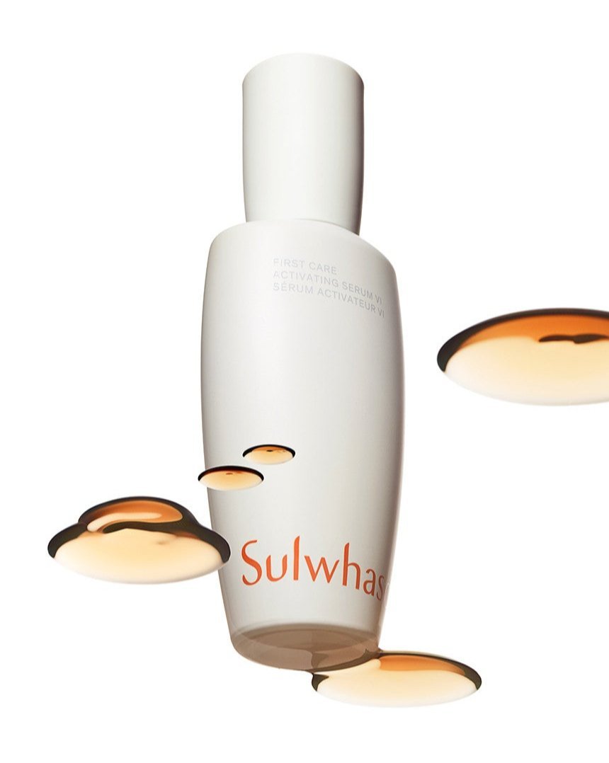 Minimalist white serum bottle with amber serum drops emphasizing moisture retention benefits