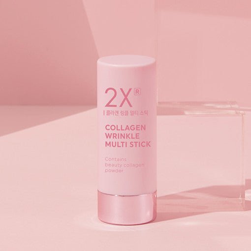 Pink collagen wrinkle multi stick with metallic cap on soft pink surface highlighting skin elasticity benefits