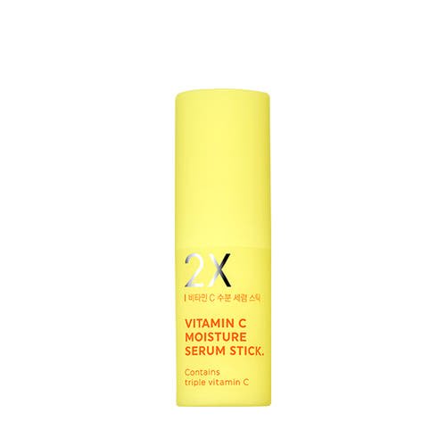 Yellow serum stick container with bold text highlighting triple vitamin C for brightening moisture care benefits
