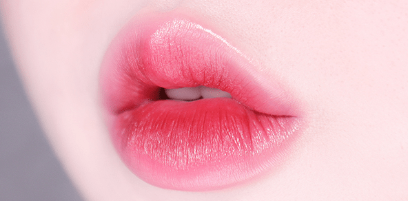 Close-up of smooth lips with soft gradient lip liner in pinkish red tone showcasing comfortable wear effect