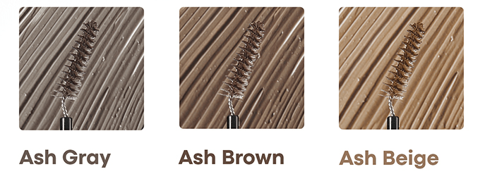 Three brow mascara wands coated with ash gray, ash brown, and ash beige shades against matching textured backgrounds