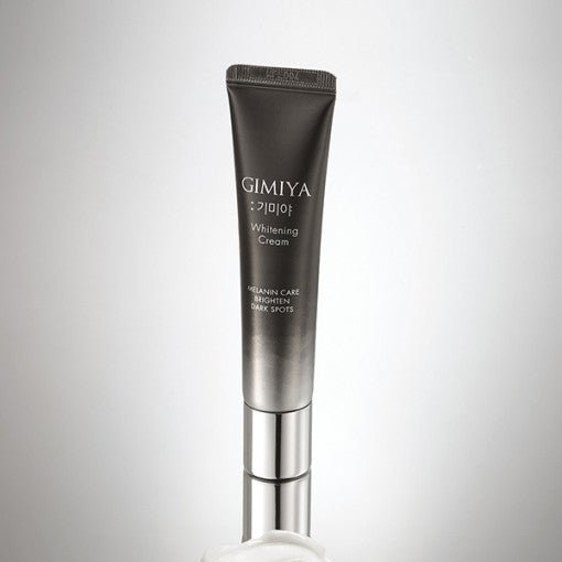 Gradient gray tube of brightening cream with silver cap designed for melanin care and dark spot reduction