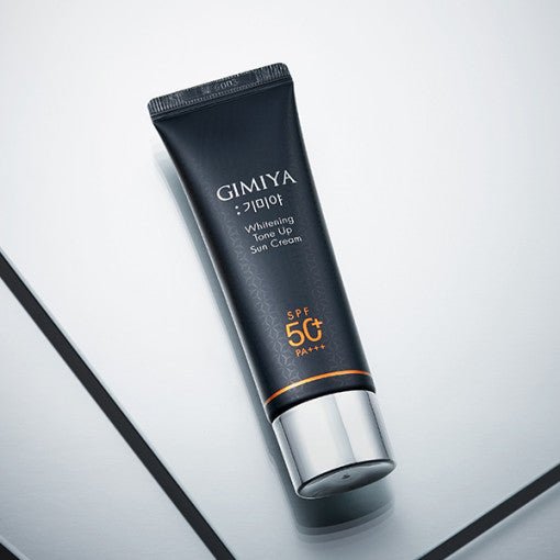 Black matte tube of whitening tone-up sun cream with silver cap and SPF50+ PA+++ effective protection label
