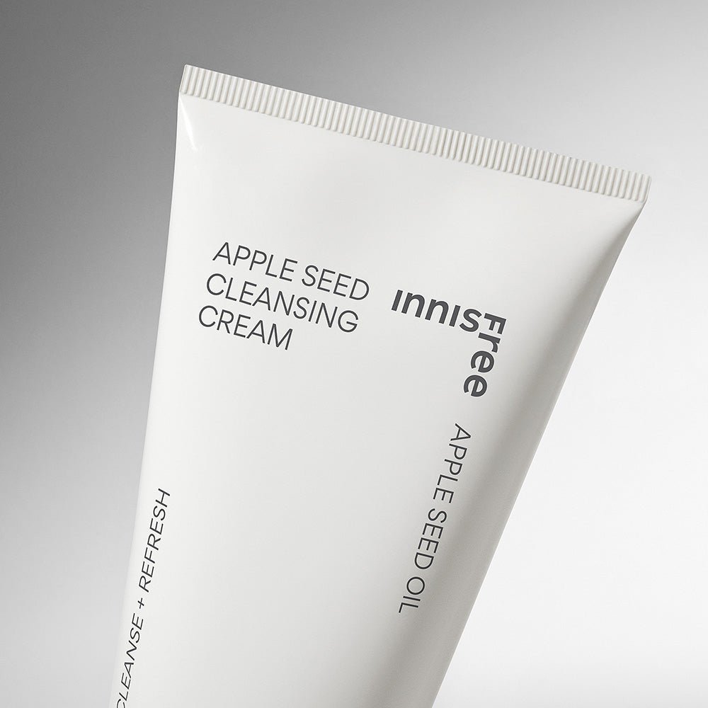 Minimalist white tube of gentle apple seed cleansing cream with clean black text on a soft gradient background