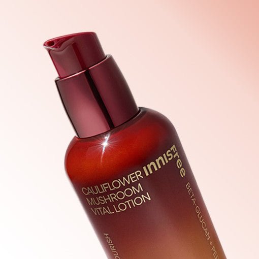 Bottle of deep red lotion with pump dispenser promoting intense hydration and vital skin nourishment benefits