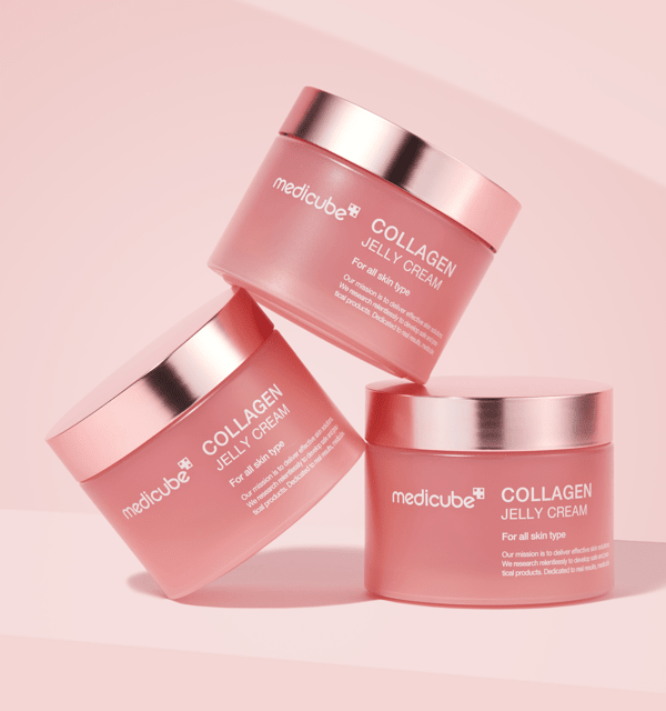 medicube Collagen Jelly Cream 50ml pink jars with metallic rose gold lids arranged on soft pink background