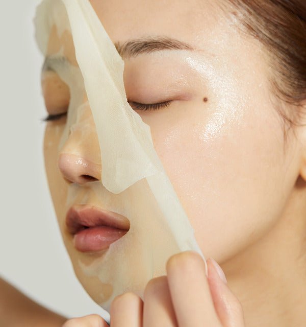 medicube Deep Vita C Daily Quick Mask 350ml/30Sheets being gently removed showing bright, glowing skin underneath