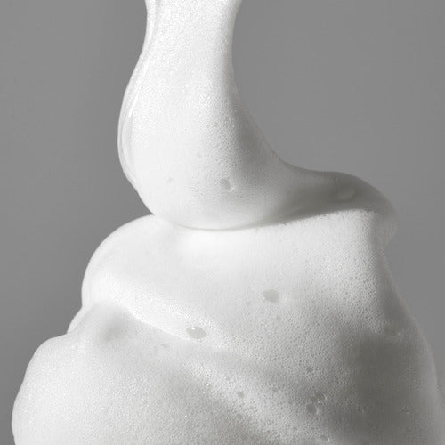 medicube Red Foam Cleanser 230ml rich white foam demonstrating deep cleansing texture on gray background