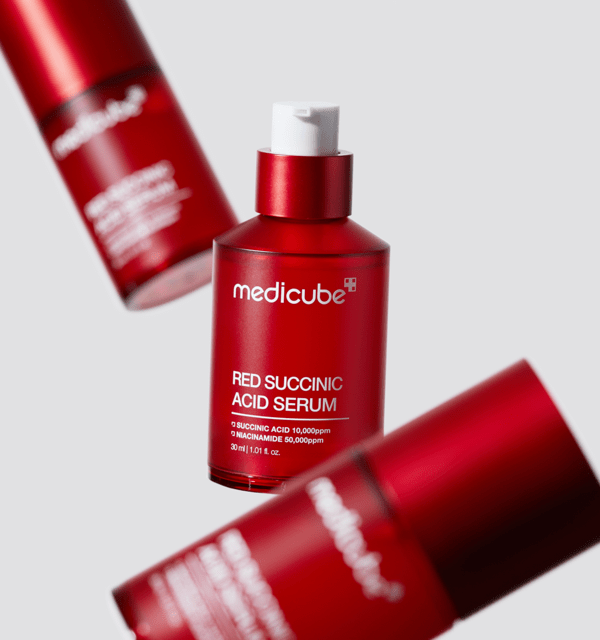 medicube Red Succinic Acid Serum 30ml bottle in red packaging for acne relief skincare treatment