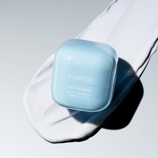 LANEIGE Water Bank Blue Hyaluronic Cream Moisturizer 20ml in light blue compact placed on white moisturizing cream spread