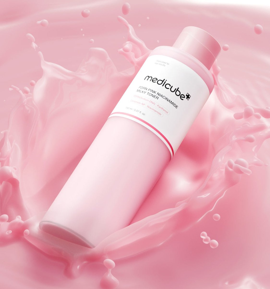 medicube PDRN Pink Niacinamide Milky Toner 150ml bottle surrounded by pink milky splash for hydration boost