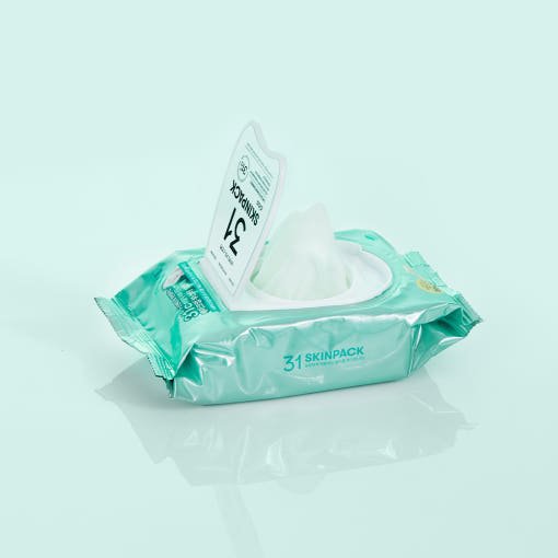 VT Mild 31°C Skin Pack 210g/100ea in teal-green pack with opened lid showing gentle hydration foam inside