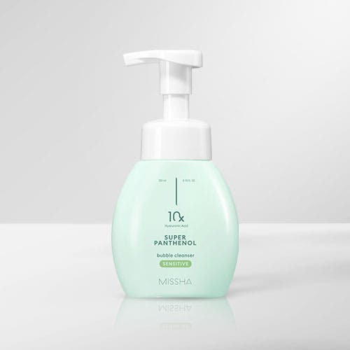 Light green foam cleanser bottle with white pump for gentle deep cleansing on plain light gray background