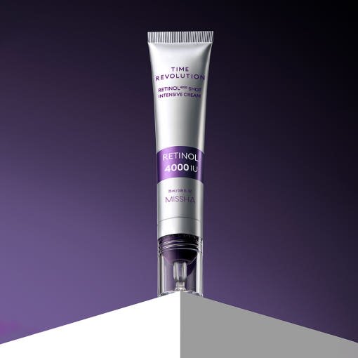 Silver tube of intensive anti-aging retinol cream with purple label showing 4000 IU on deep purple background