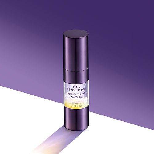 Sleek purple bottle of wrinkle-reducing retinol ampoule with minimalist white and yellow label on purple backdrop