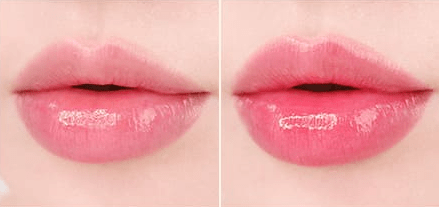 Close-up of lips showing natural pink tint and glossy finish from moisturizing balm application on smooth skin background