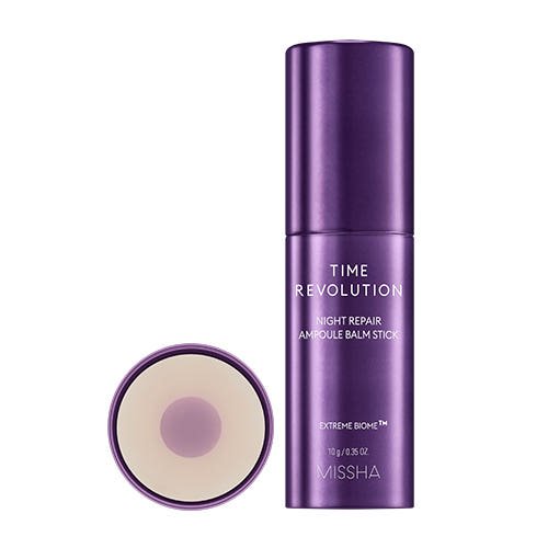 Purple cylindrical balm stick container with white text highlighting brightening night repair benefits on white background