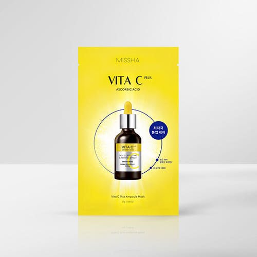 Bright yellow packaging of a mask featuring serum bottle with dropper emphasizing dark spot reduction benefits