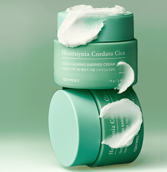 Mint green jars of calming barrier cream with creamy white texture swirled on top and side against pale green background