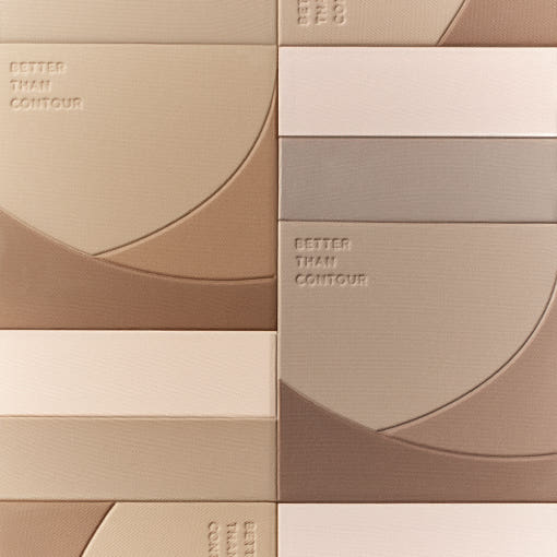 Close-up of matte contour powder palettes with soft beige and brown tones featuring embossed "Better Than Contour" text.