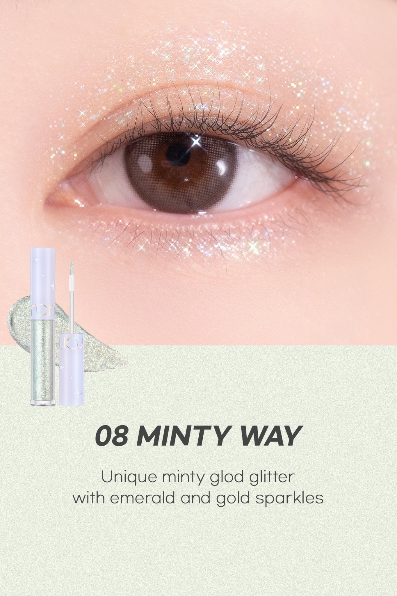 Close-up of eye with shimmering minty gold glitter makeup featuring emerald and gold sparkles and applicator tubes nearby