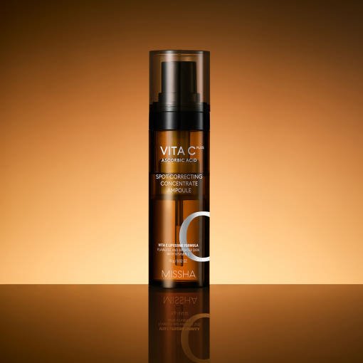 Amber pump bottle of moisturizing spot correcting concentrate ampoule on reflective surface with warm background