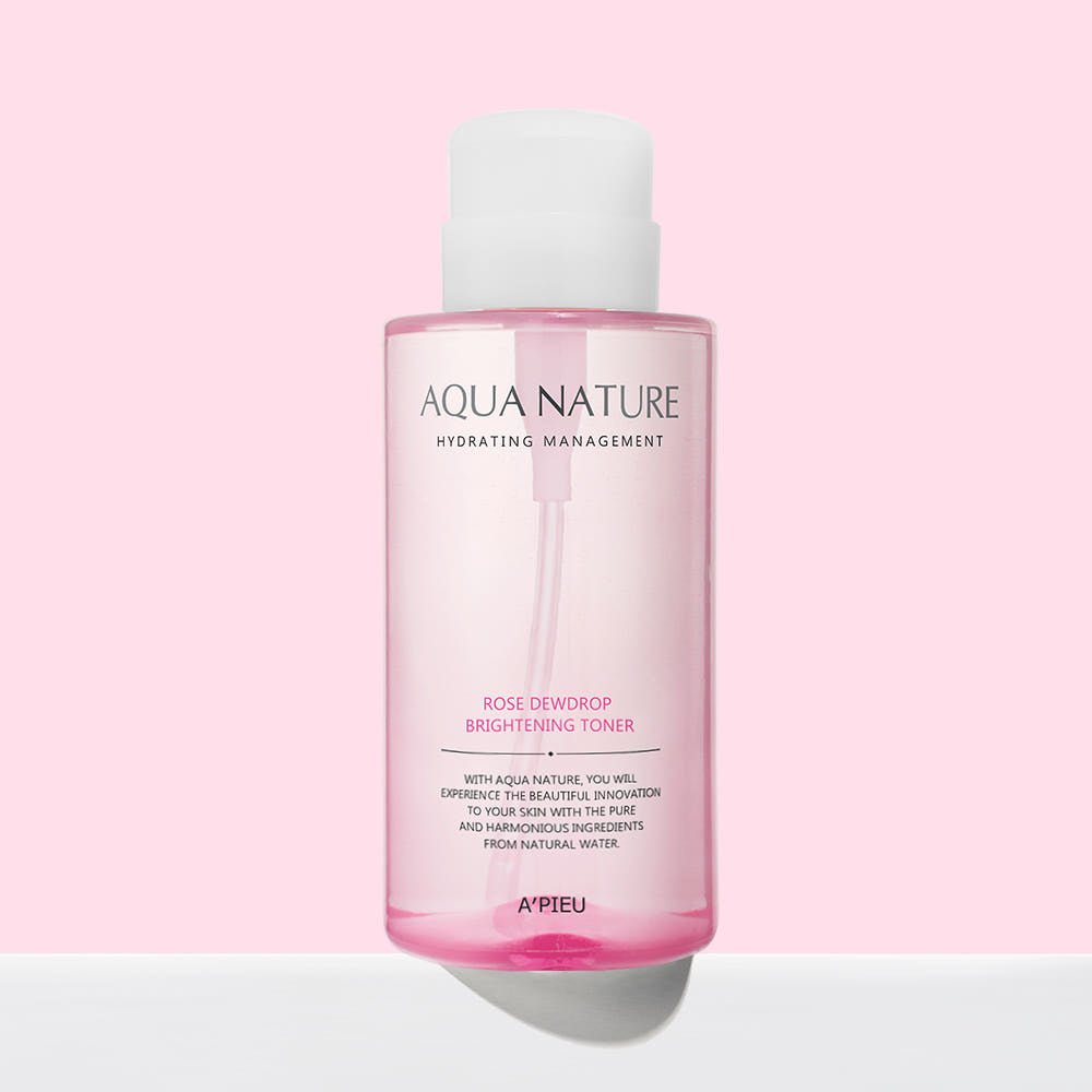 A'pieu Aqua Nature Rose Dew Drop Brightening Toner 500ml in translucent pink bottle on soft pink background