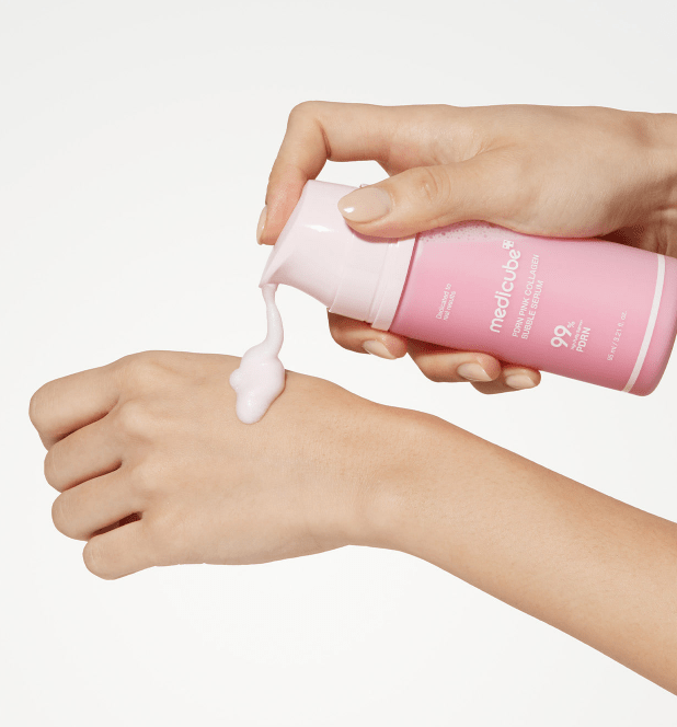 medicube PDRN Pink Collagen Bubble Serum 95ml dispensing soft pink serum onto hand for deep hydration effect