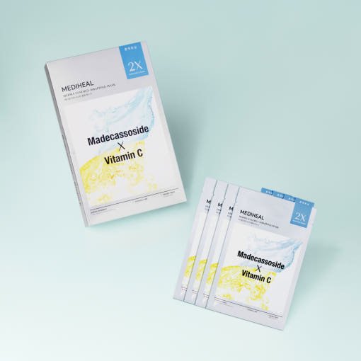 MEDIHEAL brightening face mask box with four individual white sachets featuring blue and yellow accents on pale background
