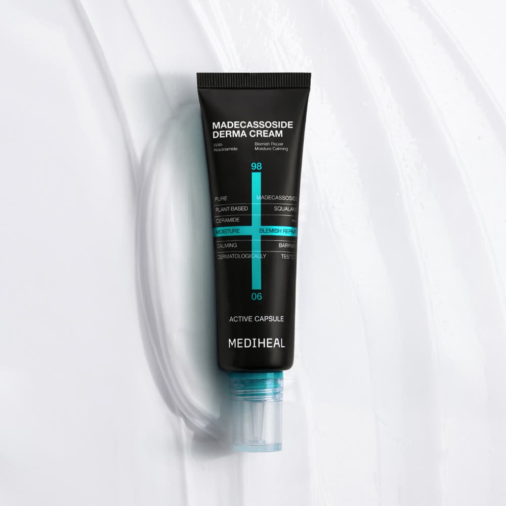 Black tube of soothing cream with blue accents and white text on a smooth white textured background.